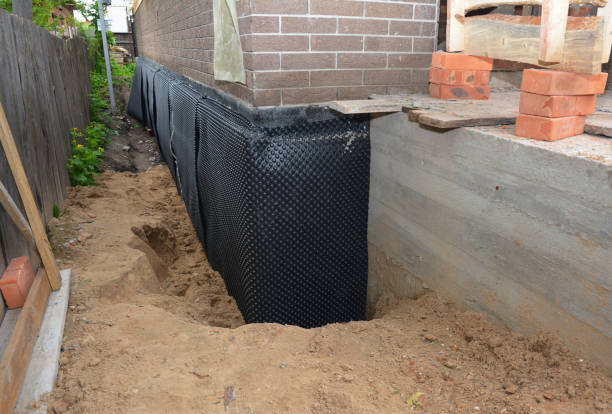 Happy homeowners after waterproofing job in Windfall